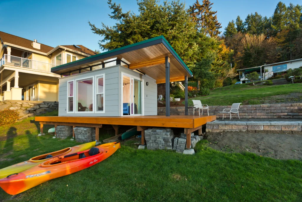 Modern backyard shed with covered deck and outdoor seating
