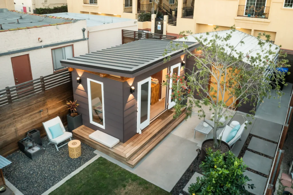 Contemporary backyard shed with deck and outdoor lounge area
