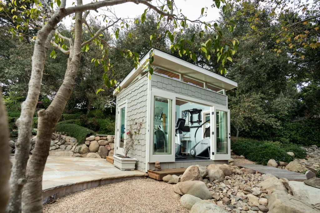 Modern backyard gym shed with large glass doors