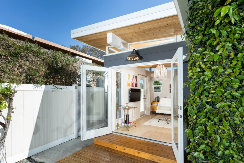 Contemporary garden studio with open entry and wood deck